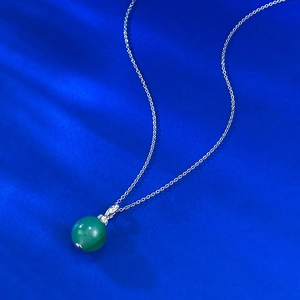 Elegant S925 silver necklace featuring 12mm green jadeite bead and zircon pendant