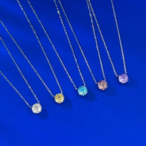 Detail of five S925 silver necklaces with round-cut crystals in multiple colors