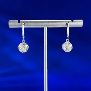 Close-up of S925 silver drop earrings featuring precision millennium-cut octagonal stones