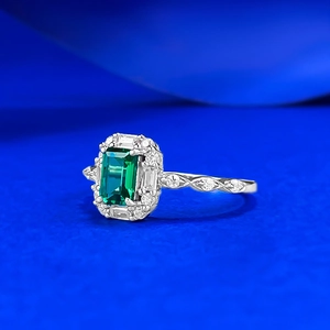 Classic emerald-cut green gemstone ring in S925 silver with a vintage diamond halo