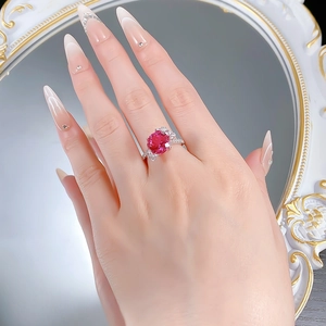 Macro shot of S925 silver ring featuring a 10mm red lotus-cut gemstone and butterfly frame
