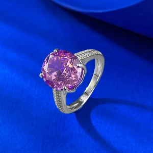 Luxurious S925 silver ring with a large round purple stone and pavé setting on silk