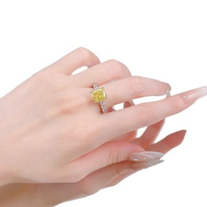 S925 sterling silver cushion cut yellow diamond ring worn on model hand in bright light