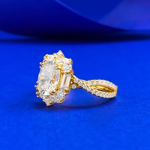 Luxurious gold oval cut zircon ring with twisted pavé band on blue velvet background