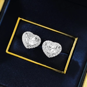Sparkling S925 sterling silver heart-shaped stud earrings with halo diamond setting
