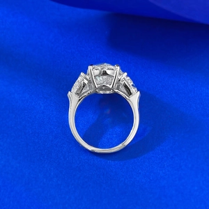Macro detail of S925 silver ring featuring a large oval center stone and side accents