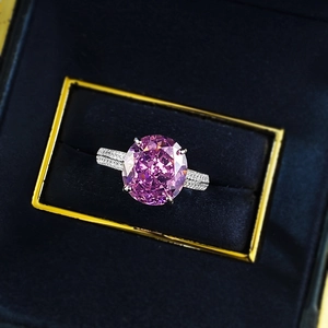 Luxurious S925 silver ring featuring a large oval pink stone and pavé diamond band