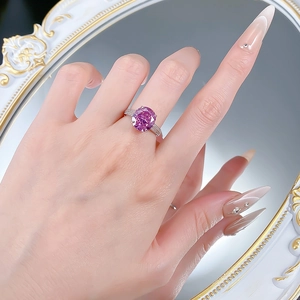 Elegant S925 silver ring with large round pink stone and diamond accents on model hand