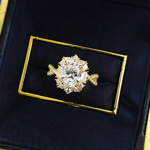Luxurious S925 silver oval zircon cluster ring in a velvet box with twisted band design
