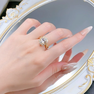 Detail of S925 silver ring with 7x9 rectangle gemstone and golden twisted band on hand