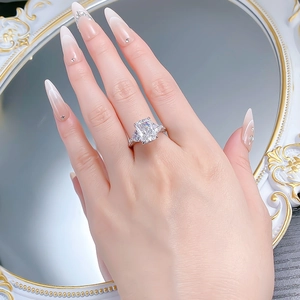 Close-up of a 5-carat rectangular radiant cut silver ring with pavé side stones