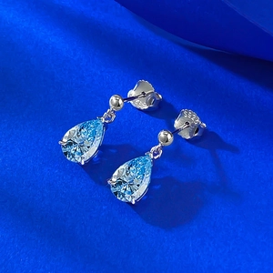 Elegant S925 sterling silver drop earrings with pear-shaped light blue gemstones