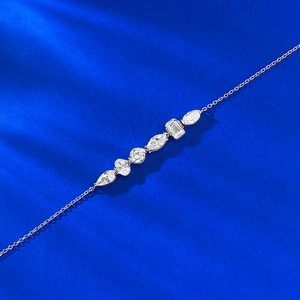 Elegant S925 silver bracelet featuring various geometric cut crystal stones on royal blue velvet
