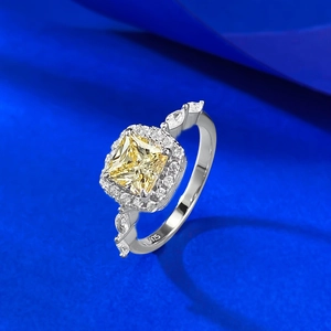 Macro shot of S925 silver ring featuring square yellow gem and halo diamond setting