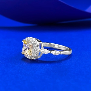 Macro detail of S925 sterling silver stamp and yellow princess cut gemstone ring