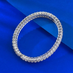 Macro detail of silver-tone tennis bracelet with brilliant square-cut cubic zirconia stones