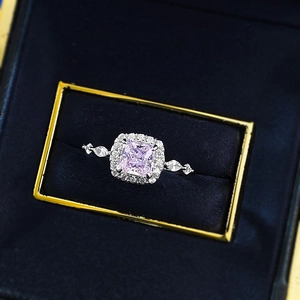 Elegant S925 silver ring featuring a square pink diamond centerpiece in a blue velvet box