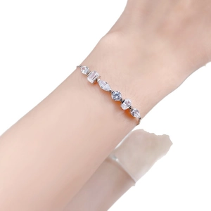 Elegant S925 sterling silver bracelet featuring mixed-cut zircon stones on a female wrist