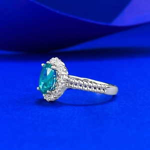 Luxurious S925 silver ring with 1.5ct oval teal gemstone and sparkling halo pavé setting