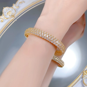 Detailed view of luxury gold multi-layer wrap bracelet with pave-set shimmering crystals