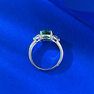 Detailed top view of a S925 silver ring featuring emerald-cut green and blue gemstones