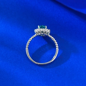 Close-up of S925 silver ring with 1.5 carat blue-green gemstone and milgrain details