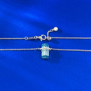 S925 silver necklace featuring a rectangular blue topaz pendant on royal blue backdrop