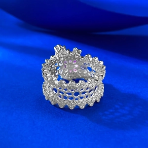 Detailed macro view of S925 sterling silver hollow lace ring band with white zircons
