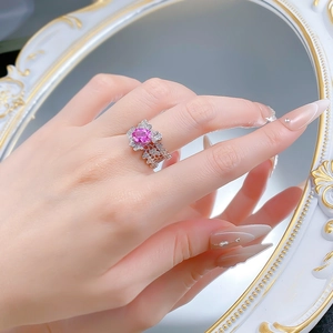 Close-up of S925 silver lace ring featuring a pink oval gemstone and sparkling diamonds