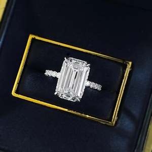 Classic S925 silver emerald cut ring with pavé diamonds in a navy velvet jewelry box