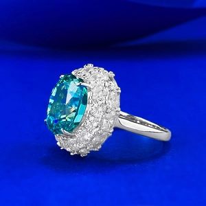Luxury S925 silver ring featuring a large oval green gemstone surrounded by sparkling diamonds