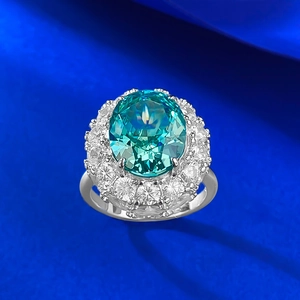 Elegant S925 silver ring featuring an oval blue-green gemstone with double diamond halo