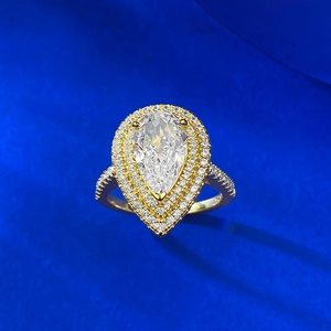 Detailed macro shot of S925 hallmark on a gold-plated pear-cut halo engagement ring