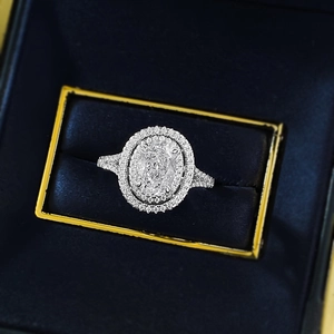 Luxurious S925 sterling silver oval halo ring with sparkling pavé diamonds in jewelry box