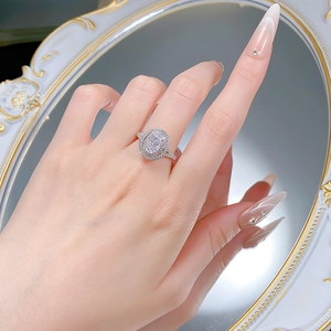 Luxurious S925 silver oval cut ice flower carbon diamond ring worn on a hand