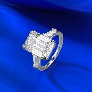 Classic S925 silver ring with large emerald cut transparent gemstone on blue satin