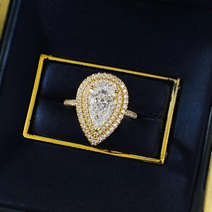 Detailed close-up of a pear-shaped S925 silver ring with double halo diamond setting