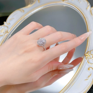 Detail of an oval halo ring with sparkling ice flower cut on a vintage mirror