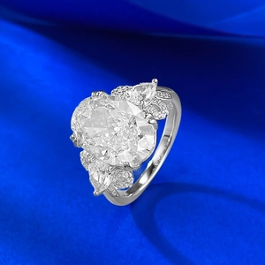 Luxurious S925 silver oval cut carbon diamond ring with pear stones on blue silk