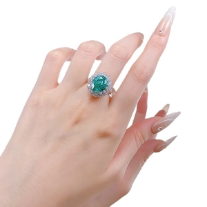 Luxurious S925 silver ring with large oval green gemstone and halo of brilliant diamonds