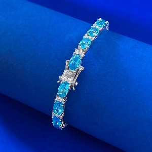 Elegant S925 silver tennis bracelet with oval blue stones and sparkling accent diamonds