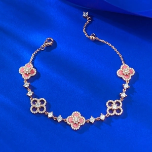 Rose gold clover bracelet with pink stone accents and sparkling pave diamonds