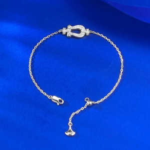 Close-up of S925 sterling silver horseshoe bracelet with sparkling zircon pavé detail