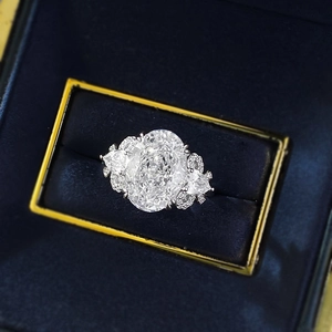 Luxurious S925 silver oval-cut high carbon diamond ring with pear-shaped side stones
