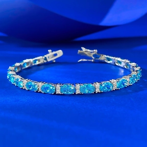 Luxurious S925 sterling silver bracelet featuring oval blue gems and sparkling zircons