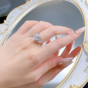 Macro detail of S925 silver ring with 9x13 oval carbon diamond and petal-shaped accent stones
