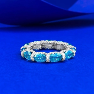 S925 silver eternity ring with oval light blue gemstones and diamond-like micro-pave