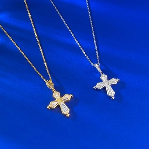 Detail of S925 silver iris cross pendant featuring geometric zircon stones in gold and silver