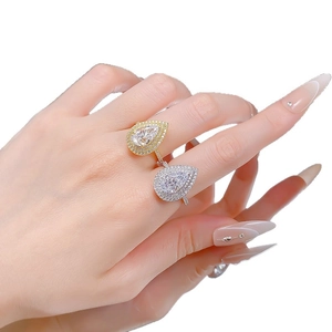 Elegant silver and gold S925 pear cut iced out drop rings with pave diamond setting