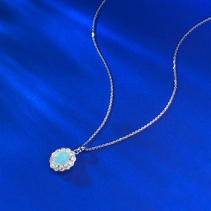 S925 silver necklace with blue oval larimar pendant on a dark blue silk background